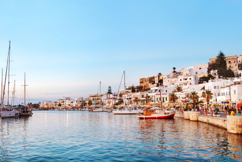 View of Naxos town harbor with several boats after Sunset, Naxos Island, Cyclades Islands, Greece