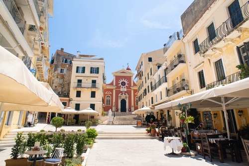 Picturesque street and main square with cafes and flowers in the old town of Corfu (Kerkyra) on the Island of Corfu, Greece