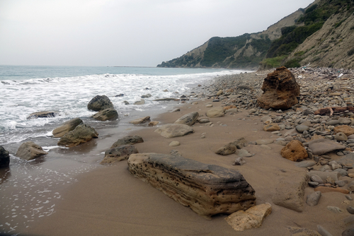 Secluded beach and cliffs at Cape Asprokavos on the Island of Corfu, Ionian Islands, Greece