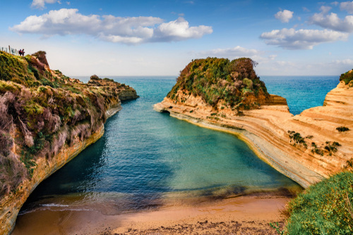 Wonderful Spring view of the famous Channel Of Love (Canal d'Amour) beach, bright morning seascape of Ionian Sea. Amazing outdoor scene of Corfu Island, Ionian Islands, Greece