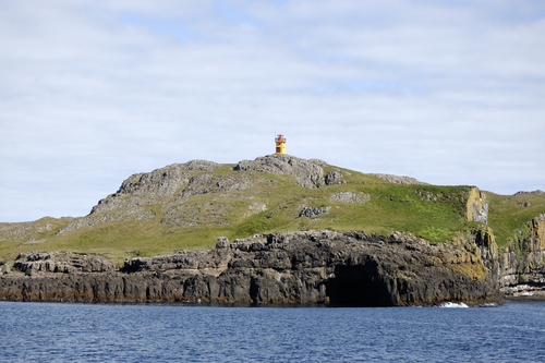 View of the lighthouse on the island of Papey, east Iceland