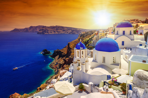 Beautiful Sunset over Oia town on Santorini island, Cyclades Islands, Greece