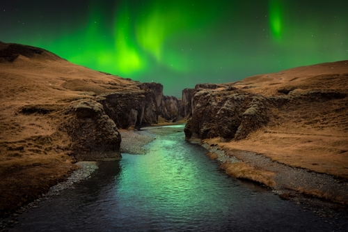 Aurora over the beautiful Fjaðrárgljúfur canyon with river Fjadra, Southeast Iceland