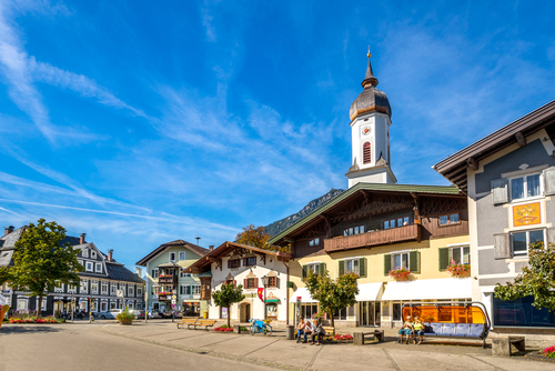View of the church bell tower in a street in Garmisch-Partenkirchen in Bavaria, Germany