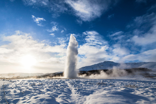 Geysir (The Great Geysir) erupting, a geyser in Haukadalur valley on the slopes of Laugarfjall hill, Golden Circle, southwestern Iceland