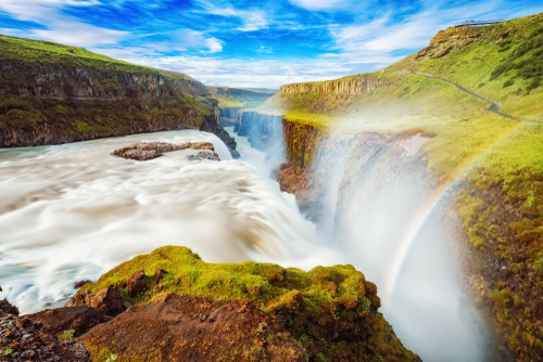 Captivating scene with rainbow of Gullfoss waterfall that is most powerful waterfall in Iceland located within the Golden Circle