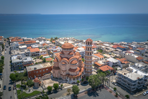 Aerial view of Ekklisia Panagia Korifini church and Nea Moudania coast city, Halkidiki (Chalkidiki) peninsula, Greece