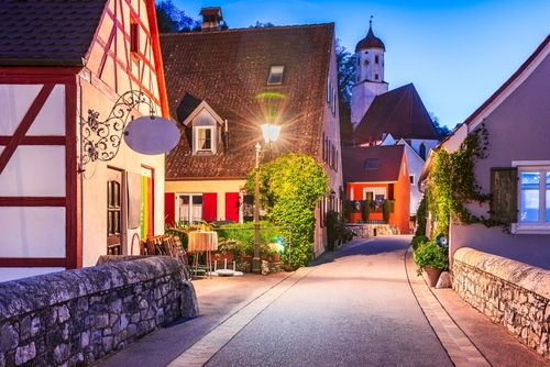 Charming town in Bavaria with picturesque streets, magical blue hour, sky painted in shades of blue and orange, Harburg, Bavaria, Germany