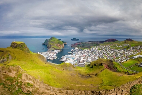 View of the city and mountains on Heimaey Island, the largest Island in the Westman Archipelago, Iceland