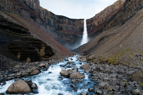 Amazing view of Hengifoss Waterfall. Hengifoss, is eye-catching due to the striking red clay and black basalt patterns on the cliff face. Fljótsdalshreppur, east Iceland