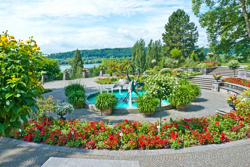 Beautiful gardens located on the Mainau Island, Bodensee, Bavaria, Germany. The Mediterranean Terrace with the fountain arena offers an amazing view to Lake Constance
