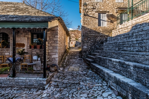 View of cobbled-stone alleys at Kallarites village in Tzoumerka epirus, Epirus, Greece, on a Sunny Winter day