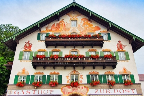 Hotel Gasthof zur Post decorated with Luftlmalerei, bayern art form of facade painting in Kochel am See in Bavaria, Germany