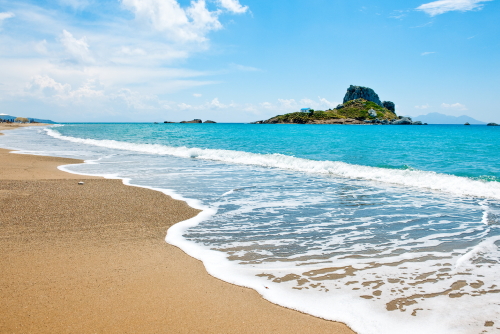 The beach at Kefalos bay and the Kastri little island on the Island of Kos, Dodecanse Islands, Greece