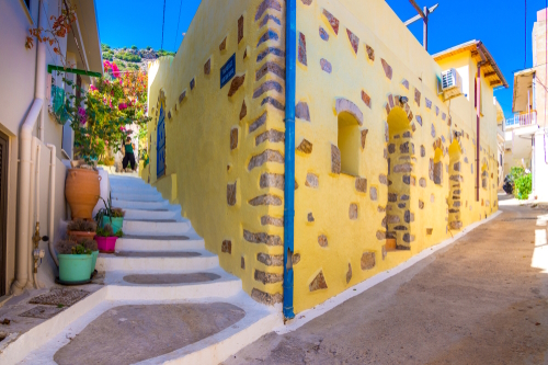 Traditional Cretan village of Kritsa with narrow alleys and houses with bougainvilleas, near Agios Nikolaos, Crete Island, Greece