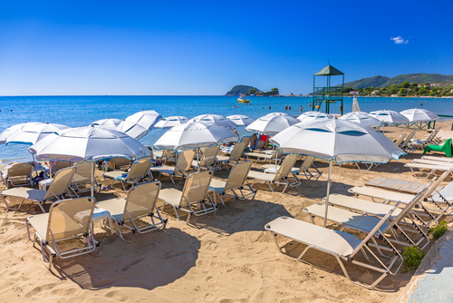 People on the beach of Laganas and its facilities on the Island of Zakynthos, Ionian Islands, Greece