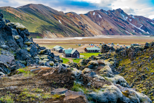 Tents and camping at Landmannalaugar in Highlands of Iceland with the beautiful mountains in the background