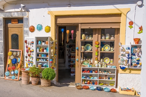 Ceramic workshop with pots handmade ceramic pots and other traditional local products in pottery shop in the village Margarites, Rethymno, Crete Island, Greece