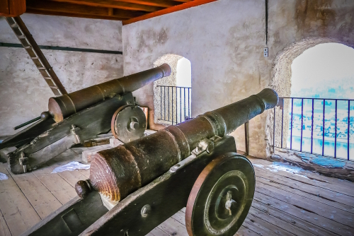 Gun battery with cannons at the Marksburg castle from the medieval age inside in winter at the Middle Rhein valley near Koblenz, Rhineland-Palatinate, Germany