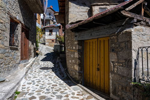 Stone houses of traditional architecture and cobble-stone narrow streets in the town of Metsovo, Tzoumerka, Epirus, Greece