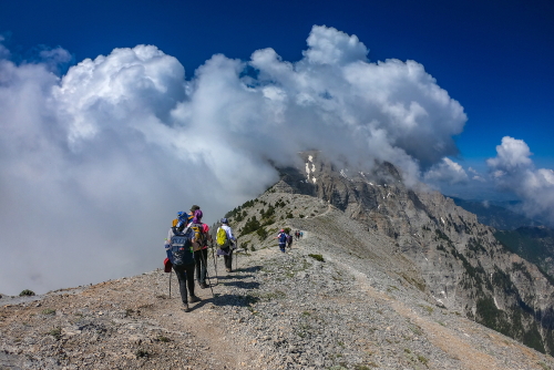 People hiking towards the summit of Mount Olympus, Mount Olympus National Park, Thessaly, Greece