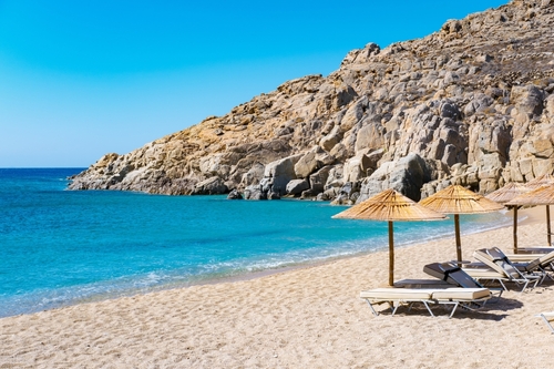 Agrari Beach and its facilities with blue sea, wild and quiet, famous for diving, snorkeling, and water sports on the Island of Mykonos, Cyclades Islands, Greece