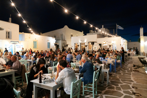 Seaside tavernas at the old harbour of Naousa town on the Island of Paros, Cyclades Islands, Greece