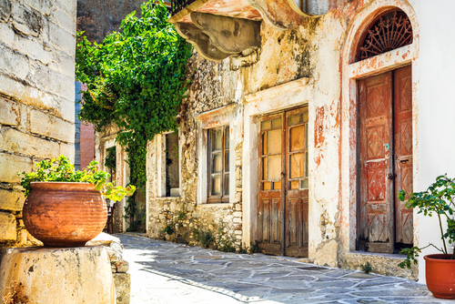 View of a charming narrow street of a traditional greek village, Naxos Island, Cyclades Islands, Greece