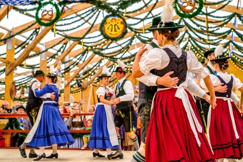 Typical bavarian traditional dancers in a beertent 