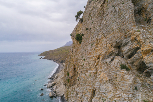 View of the sorrounding cliffs next to the Paralia Thermes springs bath on the Island of Kos, Dodecanse Islands, Greece