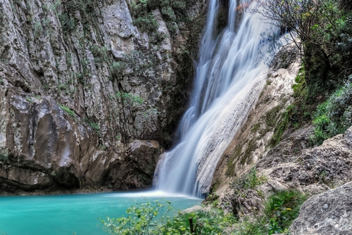 Natural waterfall and lake in Polilimnio area, it is a complex of waterfalls and lakes located near Charavgi Municipality, Messinia prefecture, the Peloponnese, Greece