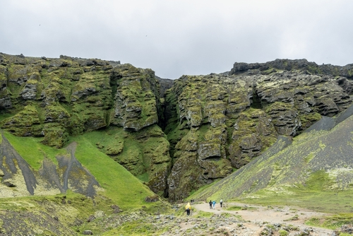 Tourists hike up to the famous Raudfeldsgja Gorge in Snaefellsnes Peninsula, Iceland