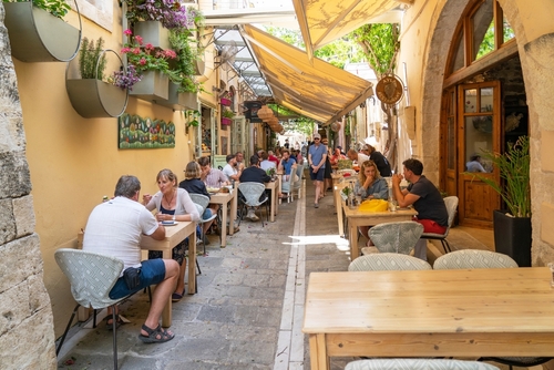 Full terraces in the cozy alleys such as Xanthoudidou street in Rethymno, Island of Crete, Greece