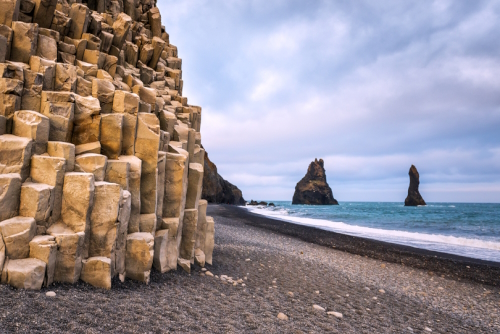 Basalt rock formations (Troll toes) on Reynisfjara black beach, Vik, southern Iceland