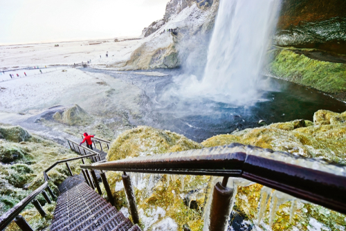 View of the icy walking path next to Seljalandsfoss waterfall in Winter, Landmannalaugar Reservation, Iceland