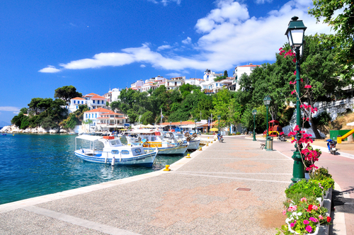 A view of several boats and the beautiful waters in the old port of Skiathos Town, Skiathos Island, Sporades Islands, Greece
