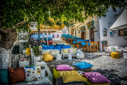 Colorful pillows at street cafes in Skiathos Town on the Island of Skiathos, Sporades Islands, Greece