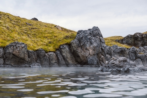Sky Lagoon in Iceland. Geothermal spa with heated water on cold day