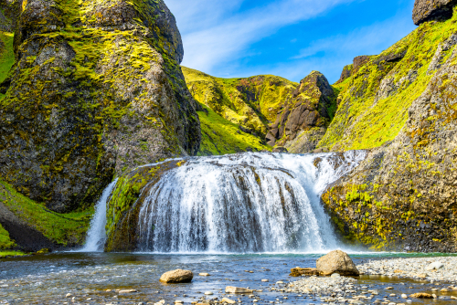 Magical big waterfall called Stjornarfoss near Kirkjubaejarklaustur at Iceland South coast, summer time