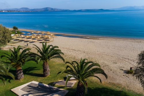 Aerial view of Nia Makri beach and its facilities at the Athens riviera, Attica, Greece