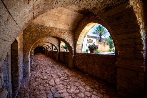 Arkadi monastery on Crete island, Greece. Ekklisia Timios Stavros, Moni Arkadiou in Greek. It is a Venetian baroque church. Details of the yard and the buildings outside the church