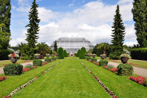 View of the beautiful garden and topiary outside a glass-house in Berlin's Botanic Garden and Botanical Museum, Germany