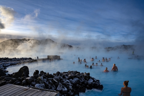 People swimming in the Blue Lagoon Geothermal bath in winter time, Reykjavik, Iceland