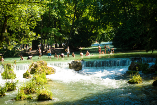 Crowds flock to the Englischer Garten Park in Munich, Bavaria, Germany. Enjoying the hot weather