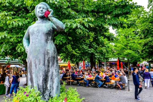 Famous statue on a well at the Viktualienmarkt in Munich, Bavaria, Germany