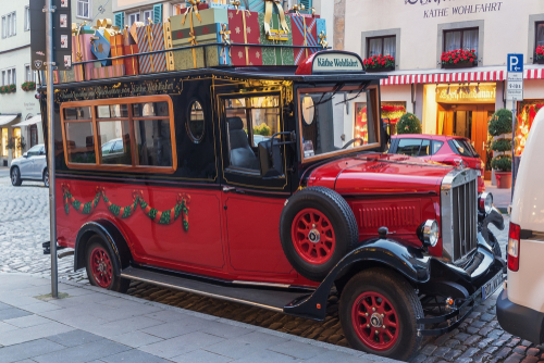 A vintage bus near the shop and Christmas museum Kathe Wohlfahrt's Christmas Weihnachtdorf in Rothenburg on the Tauber, Bavaria, Germany