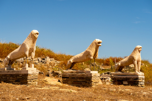 View of the three ancient stone guardian lions sculptures on Delos Island near Mykonos Island, Cyclades Islands, Greece