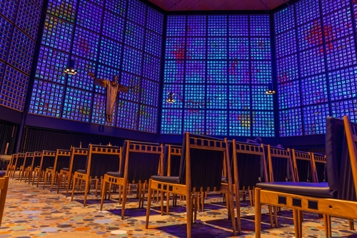 Interior view of the alter and the stained-glass at the Kaiser Wilhelm Memorial Church in Berlin Germany