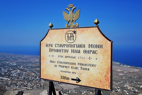 Signpost showing the direction towards the Holy Monastery of Prophet Clias Thira, Island of Santorini, Cyclades Islands, Greece