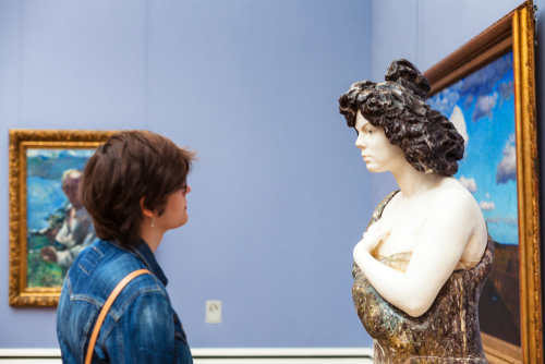 Woman in Pinakothek der Moderne in Munich, Bavaria, Germany. The New Pinakothek is art museum for modern and contemporary art